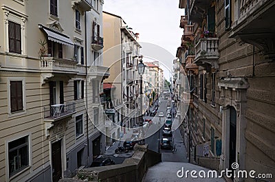 Straight narrow street between old residential buildings in typical Italian style Editorial Stock Photo