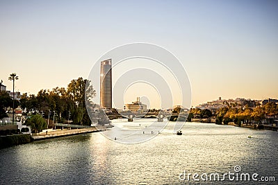 Siville - View of Siville Tower Torre Sevilla of Seville, Andalusia, Spain over river Guadalquivir at sunset Stock Photo