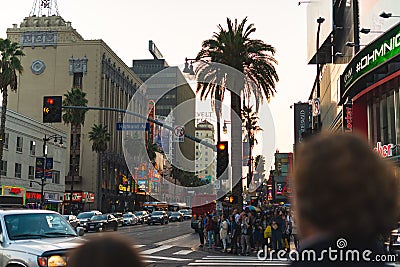 LA, USA - OCTOBER 31ST, 2018: Crowds wait to cross a busy intersection Editorial Stock Photo