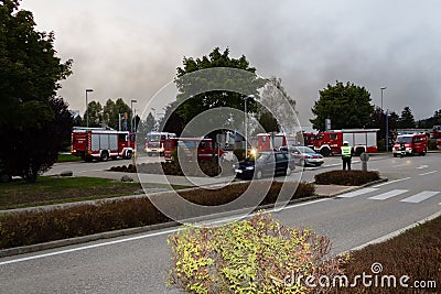 LAAKIRCHEN, AUSTRIA SEPTEMBER 24, 2015: Firefighters and fire tr Editorial Stock Photo