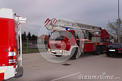 LAAKIRCHEN, AUSTRIA SEPTEMBER 24, 2015: Firefighters and fire tr Editorial Stock Photo