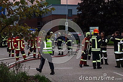 LAAKIRCHEN, AUSTRIA SEPTEMBER 24, 2015: Firefighters and fire tr Editorial Stock Photo