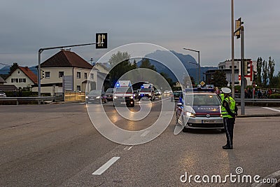 LAAKIRCHEN, AUSTRIA SEPTEMBER 24, 2015: Police stands guard at a Editorial Stock Photo