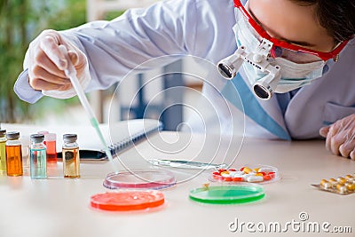 The lab assistant in drug synthesis concept Stock Photo