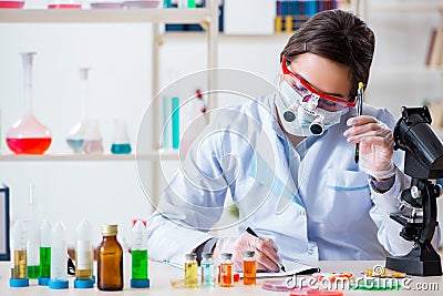 The lab assistant in drug synthesis concept Stock Photo