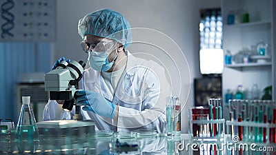 Lab assistant studying samples to detect pathologies, quality medical research Stock Photo