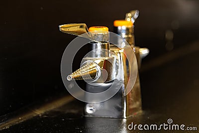 A lab gas valve on a black table and background Stock Photo
