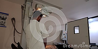 Lab technician doing X ray to the patient at laboratory Editorial Stock Photo