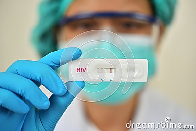 Lab technician holding HIV rapid device test Stock Photo