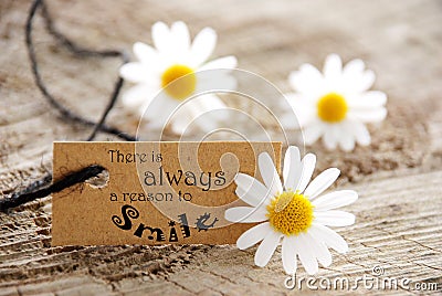 Label with Saying There is Always a Reason to Smile Stock Photo