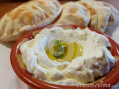 Labneh, delicious Lebanese yoghurt cream cheese and pita bread Stock Photo