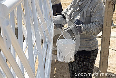 Labor was painting white color to carbon steel Editorial Stock Photo