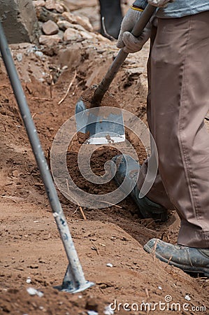 Labor work with spade for excavation Stock Photo