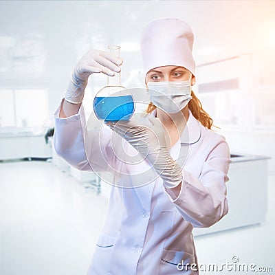 Laboratory assistant analyzing a liquid Stock Photo