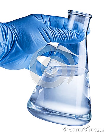 Laboratory beaker in analyst`s hand in plastic glove. Stock Photo