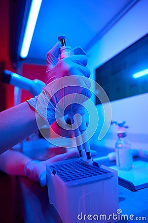 Laboratory employee in the process of preparing biomaterial for freezing Stock Photo