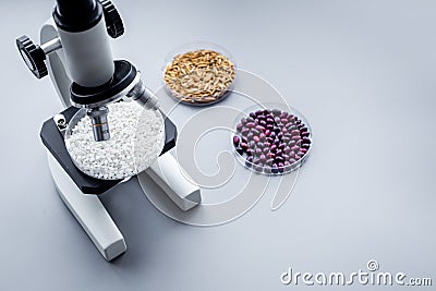 Laboratory for food analysis. Rice under the microscope on grey background copyspace Stock Photo