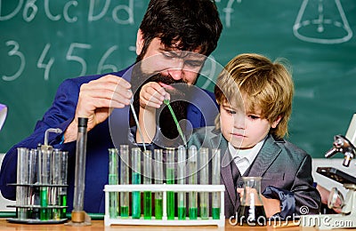 laboratory research and development. bearded man teacher with little boy. Laboratory test tubes and flasks with liquids Stock Photo