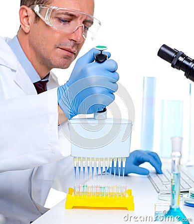 Laboratory scientist using a multi channel pipette Stock Photo