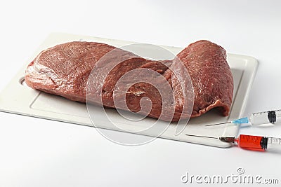 Laboratory studies of raw meat on plastic board on white background. Chemical experiment. Closeup Stock Photo