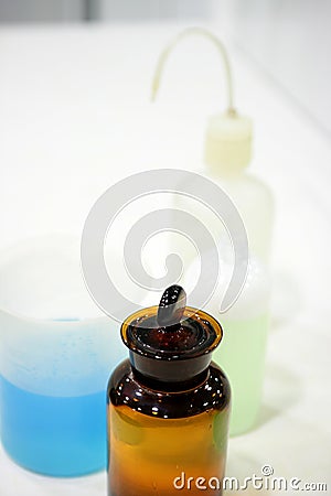 Laboratory stuff, glass cylinder, colorful liquids Stock Photo