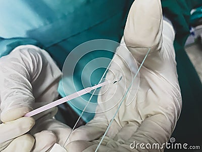 A laboratory technician testing urine sample in laboratory Stock Photo