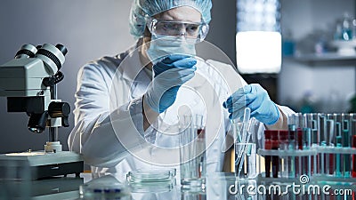 Laboratory worker measuring exact formula for hypoallergenic cosmetic products Stock Photo