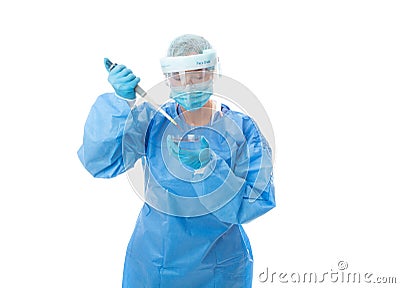 Laboratory worker or pathologist in full PPE with pipette and petri dish Stock Photo