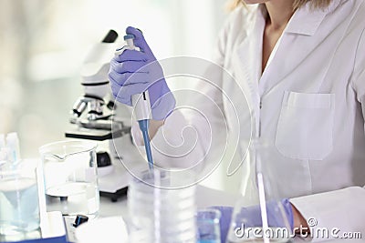 Laboratory worker in uniform does professional research Stock Photo