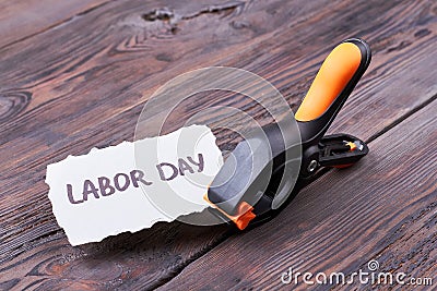 Labour Day card and clamp. Stock Photo