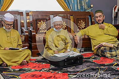 Labuan,Malaysia-Aug 22,2020:Malaysian muslim performing Quran recitation during Aqiqah ceremony in Labuan,Malaysia.Islamic traditi Editorial Stock Photo