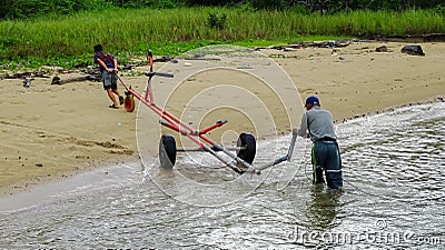 Labuan,Malaysia-May 27,2020:Traditional fisherman with fishing boat trolley in the morning at Labuan island,Malaysia.Aquaculture i Editorial Stock Photo