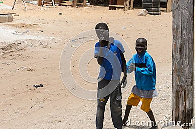 Unidentified Senegalese boys play on the street. Editorial Stock Photo