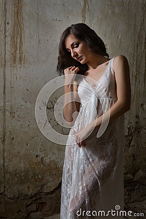Lace nightgown in derelict building Stock Photo