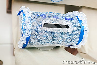 Laced blue piggy bank for newlyweds on a white background Stock Photo