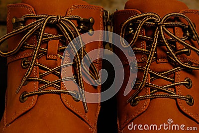 Laced brown winter boots.Background men`s and women `s shoes Stock Photo