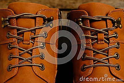 Laced brown winter boots.Background men`s and women `s shoes Stock Photo
