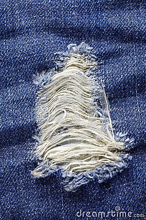 Laceration of jeans. Stock Photo