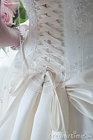 Laces on back of wedding dress Stock Photo