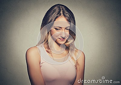 Lack of confidence. Shy young woman feels awkward Stock Photo