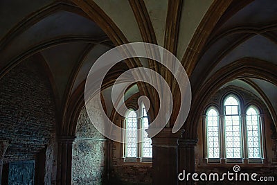 Lacock, England - March 01 2020: Shot of of dark, spooky room in the cloisters at Lacock Abbey Stock Photo