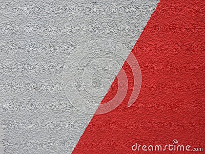 Laconic and expressive image in the form of a gray-red wall. Minimalistic abstract background image. Stock Photo
