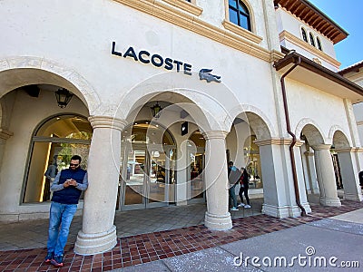 A Lacoste clothing retail store at an outdoor mall Editorial Stock Photo