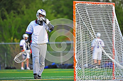Lacrosse Goalie wiping his face Stock Photo