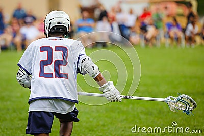 Lacrosse player in the field in action Editorial Stock Photo