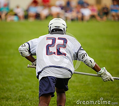 Lacrosse player in the green field Editorial Stock Photo