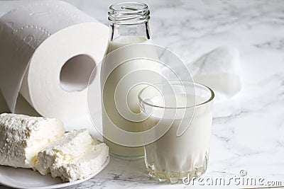 Lactose intolerance and diarrhea concept with diary and toilet paper Stock Photo