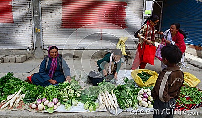 Ladakhi ladies selling fruit and vegetables Editorial Stock Photo