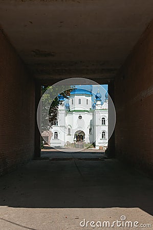 Ladan, Chernihiv, Ukraine - 08/14/2021: Building of the Orthodox Church at the end of a dark tunnel Stock Photo