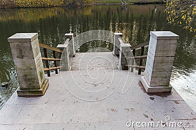 Ladder by the pond Stock Photo